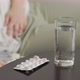 There are Glass of Water and Pills for Pain on Dark Wooden Table - VideoHive Item for Sale