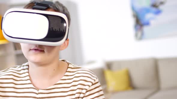 Teenage Boy Experiencing Virtual Reality Indoors