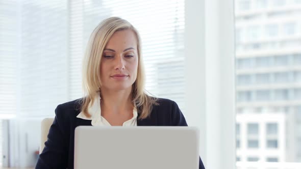 Businesswoman working on laptop