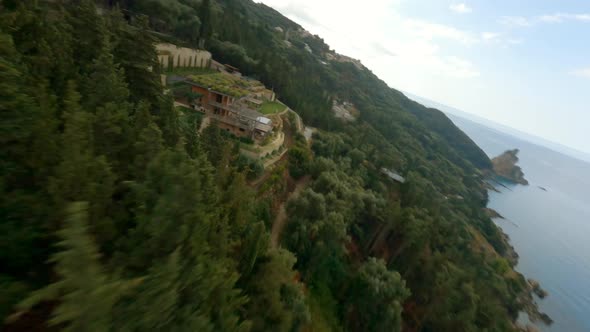 Drone Over Trees Towards Woman And Controller