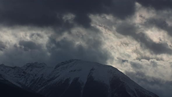 Mountain peak with clouds and light snow Time-lapse