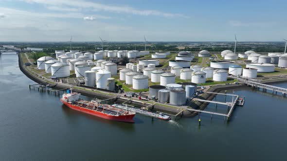 Crude Oil Liquid Cargo Transporter Ship Unloading Petrochemicals to a Fuel Depot