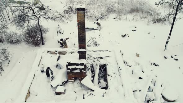 Winter Village Landscape with a Stove and a Burnt House Aerial View