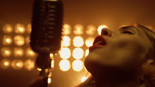 Sexy Woman Singing Solo in Microphone Close Up