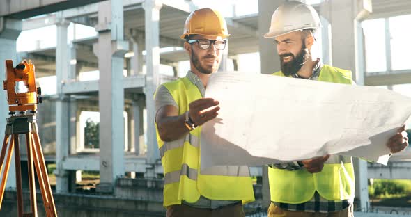 Portrait of Construction Engineers Working on Building Site