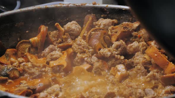 Beef and Mushrooms Chanterelles Cooking on Street Food Market Spain Barcelona