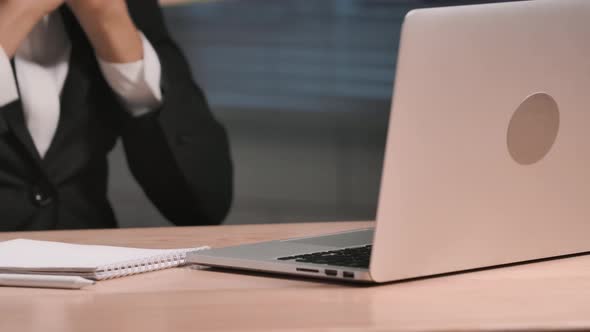 Portrait African American Woman Texting with Client Using Laptop and Rejoices at Good Deal