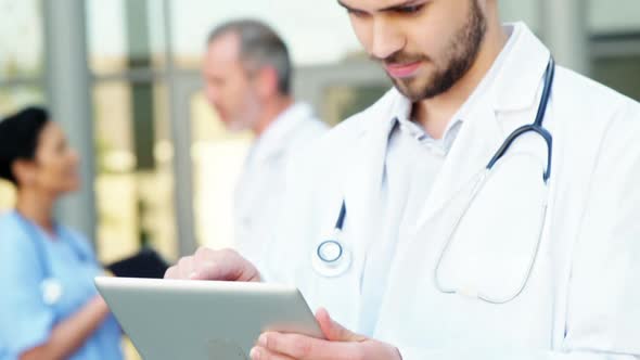 Doctor using a digital tablet in hospital
