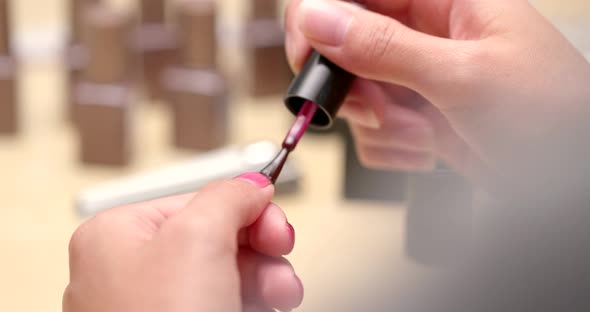 Woman making manicure at home