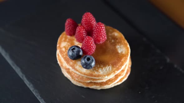 Timelapse of Fruit and Syrup Over Pancakes