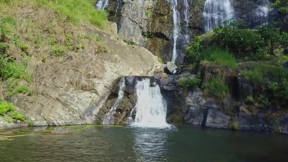 Drone Shows Amazing Waterfall Streams Falling Into Pond