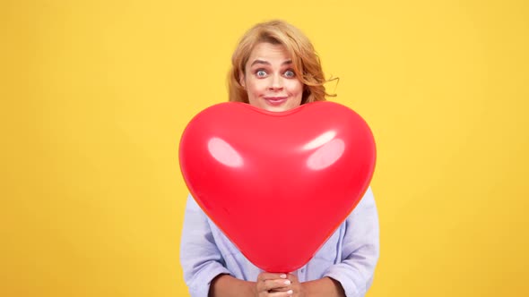 Girl with Amazed Face Blow Kiss Behind Heart Love Party Balloon Kiss