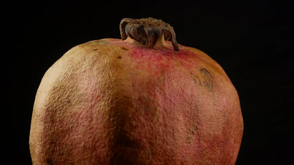 Pomegranate on black background