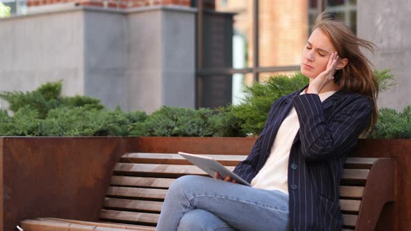 Headache, Woman Having Pain in Head while Using Tablet Sitting Outside