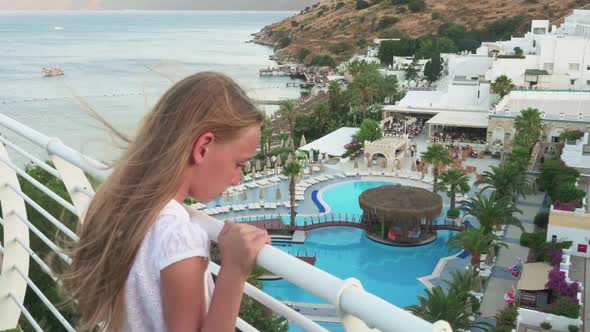 Beautiful Teenage Girl Looking at Tropical Resort