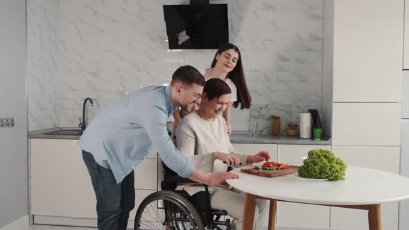 Mature Disabled Woman Cutting Vegetables in the Kitchen