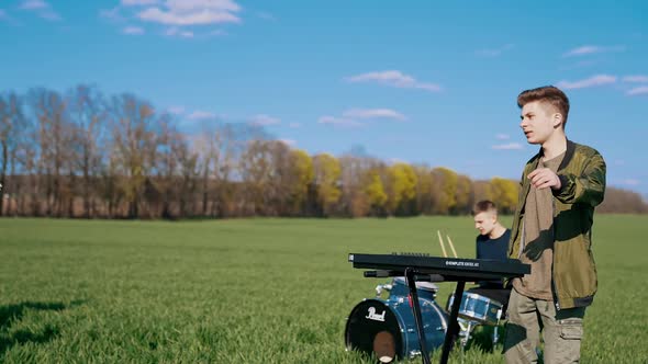 Musical band playing festival concert on field