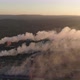 Top view of heavy industry plant. Smoking smokestacks at sunset time with beautiful golden yellow li - VideoHive Item for Sale