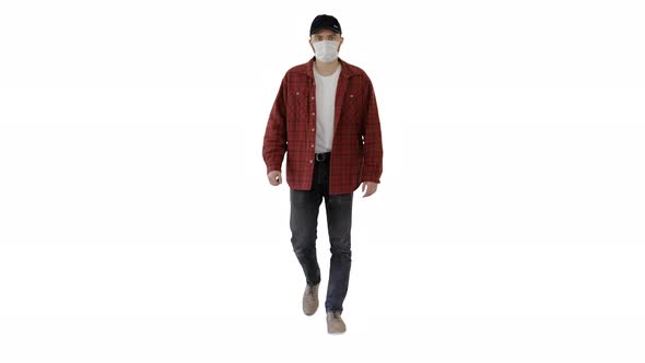 Man in Casual Shirt and Cap Walking in Medical Mask on White Background.