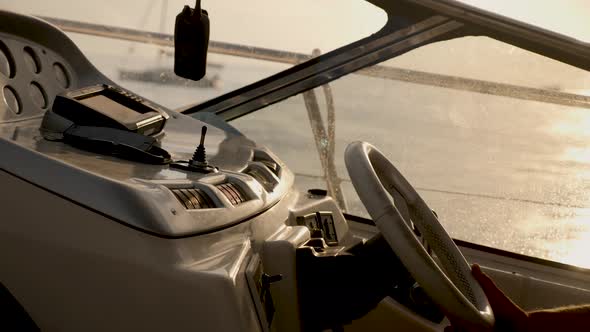 Yacht with Instruments and Steering Wheel at Sunset