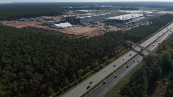 Big Factory Structure Under Construction in Rural Landscape of Germany Near Berlin, Gigafactory