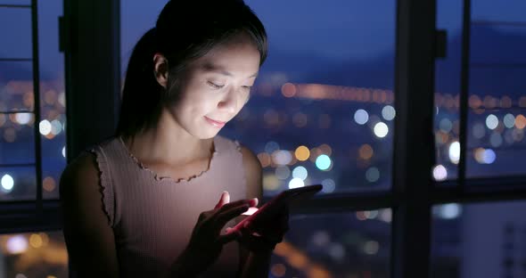Woman Use of Smart Phone in The Evening at Home 