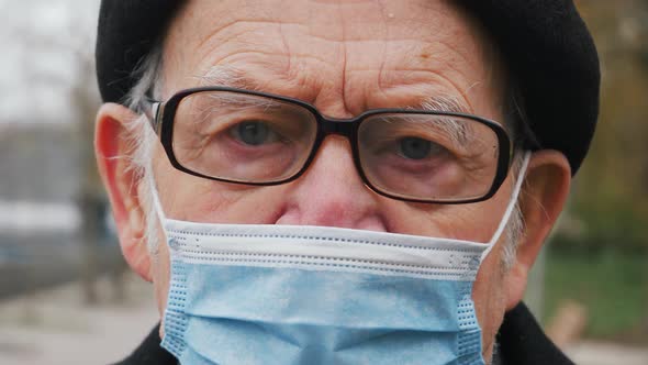 elderly senior worker looking at the camera