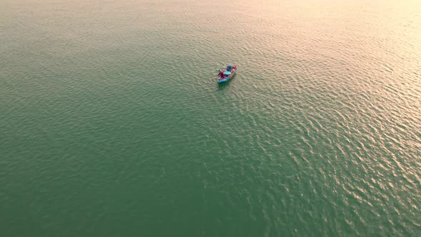 Aerial drone view of a fisherman boat in the sea near the coast.