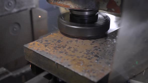 Industrial Machine Is Polishing Old Rusty Metal Blank in Workshop