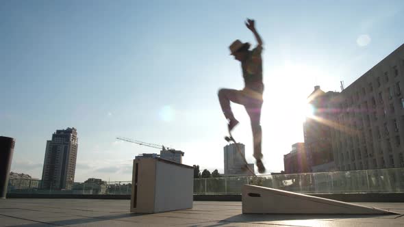 Active Skater Doing Ollie Trick Jumping Over Curb