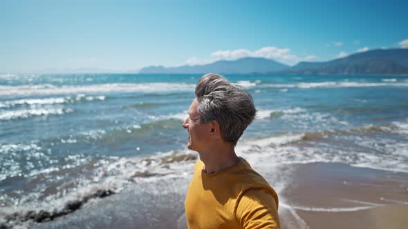 Happy Middle Aged Greyhead Man Walks Along Beautiful Beach Iztuzu and Takes Selfie at Sea Coast with