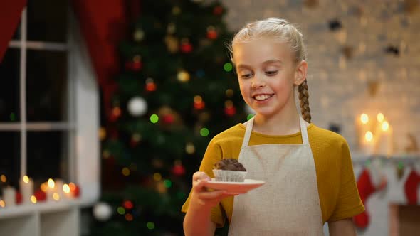 Little Happy Girl Holding Plate With Choco Muffin, Preparations Before Holiday