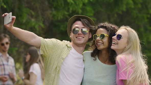 Best Friends Dancing and Taking Selfie at Cool Summer Open-Air Festival, Youth