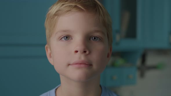 Shocked Kid Opening Mouth and Closing It with Hand