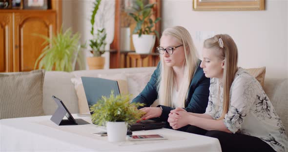 Female Colleagues Discussing Business Strategy In Office