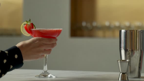 Closeup Man Bartender Serves the Client a Margarita Cocktail