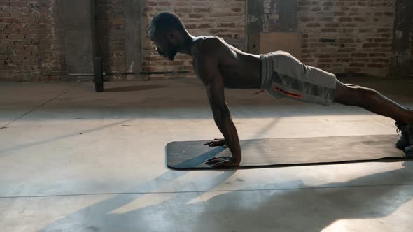 Exercise. Sport man working out in gym, doing push-up