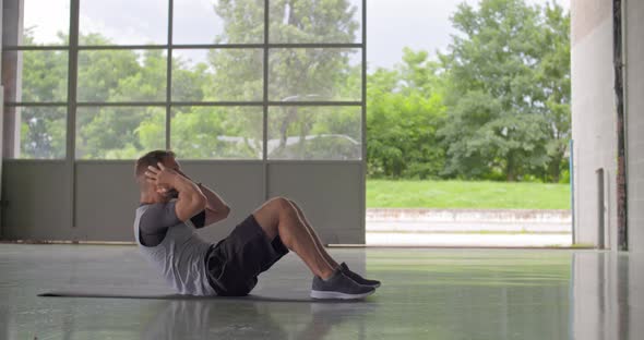 Young Adult Man Doing Situps Exercise During Fitness Sport Workout