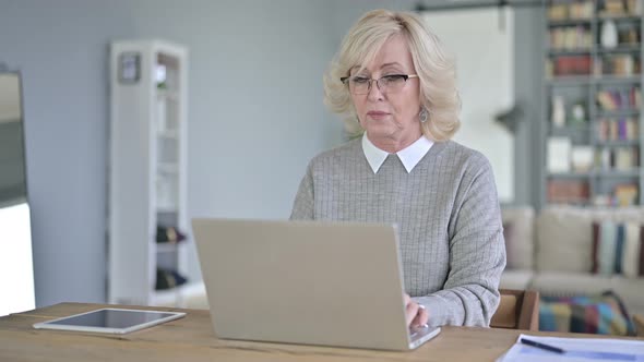 Sick Old Woman Coughing in Modern Office