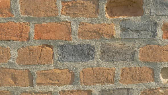 Brick wall details 4K 2160p UHD panning video - Bricks in the wall lighted 4k 3840X2160 UHD footage