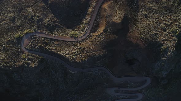 Aerial view of a car driving a serpentine road, Reunion.