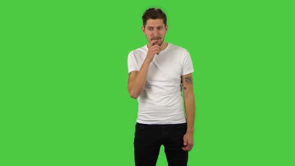Confident Guy Is Looking Around and Having Fun. Green Screen