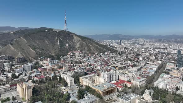 Aerial view of center of Tbilisi under Mtatsminda mountain, Georgia 2022 spring