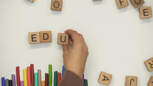 Education Word on Cubes Made by Teacher and Child, Early Development, Preschool