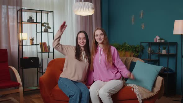 Happy Girls Siblings Making Roof Gesture Sign of Hands New Home Ownership Insurance Bank Loan