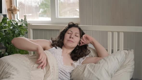 Happy Positive Middle Age Woman Stretching in Bed Wake Up in Good Mood