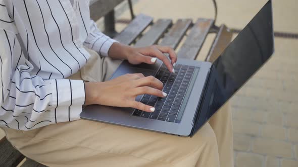 Female Hands of Business Woman Using Typing on Laptop Keyboard