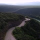 Epic Aerial Shot Car Driving with Mountain Forest Background in the Summer - VideoHive Item for Sale
