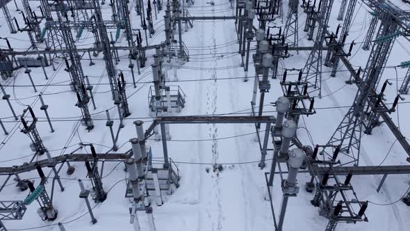 Aerial view of a high voltage electrical substation in winter season.