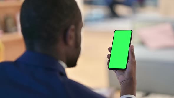 African Man Using Smartphone with Chroma Screen